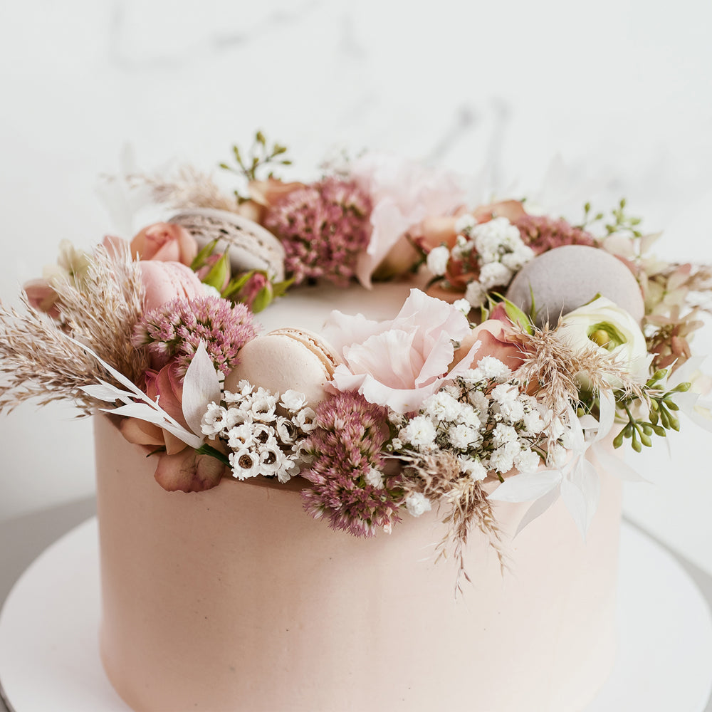 Pink buttercream cake with flower crown