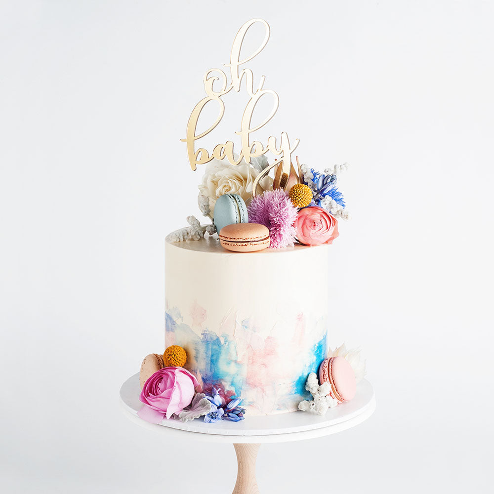 Gender reveal/baby shower cake with pink and blue watercolour buttercream